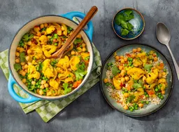Bloemkoolcurry met zilvervliesrijst en tuinerwten